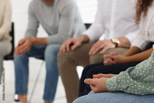 People at group therapy session indoors, closeup