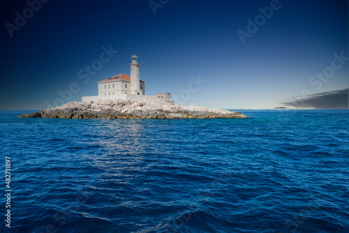 Croatia. Mulo lighthouse, also called Franz Joseph lighthouse on a small rocky island. Close to the town of Rogoznica. Adriatic Sea.