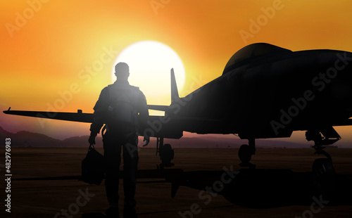 Fighter pilot walking to aboard jet fighter on airfield