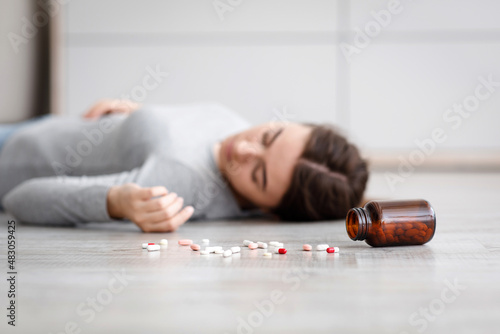 Female with pile of antidepressants kill herself, commit suicide, suffer from mental distress