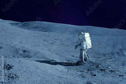 Astronaut on the moon, with galactic background. Elements of this image were furnished by NASA.