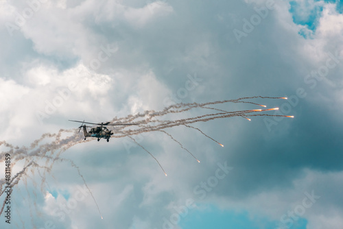 Russian Military attack helicopter shooting flares at the MACS air show in Moscow in a demonstration of Russian air power