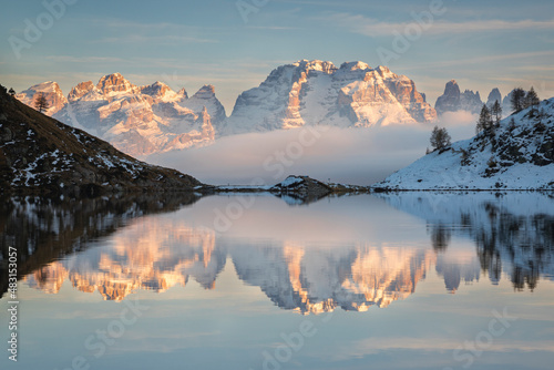 Brenta Dolomites reflected in the Ritorto lake at sunset, Adamello Brenta Natural Park, Trentino, Italy.