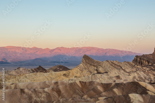 Scenery while sunrise in the Death Valley with rocks and desert in the west of the U.S.