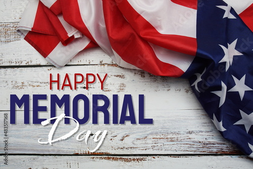 Happy Memorial Day message with American flag on wooden background