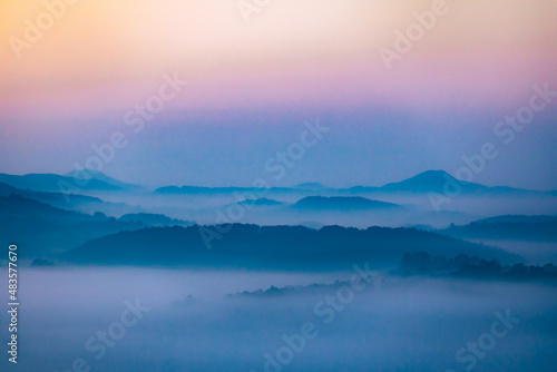 Beautiful arial landscape of amazing mountain in fog.