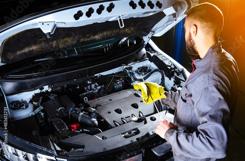 Checking the engine oil level. Auto Repair Shop or Auto Service.