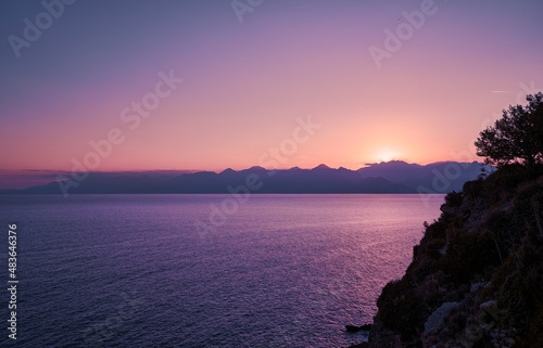 Dusk and dawn landscape. Beautiful Antalya sea bay at sunset evening time.