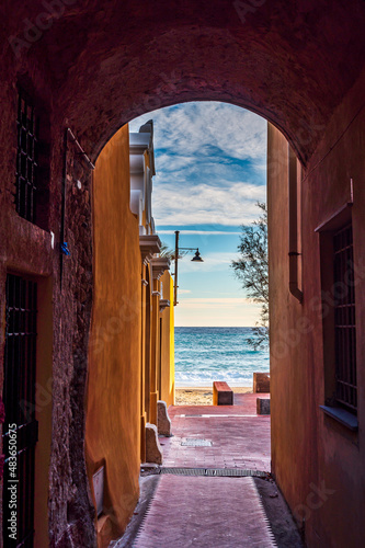 The sea viewed through an alley