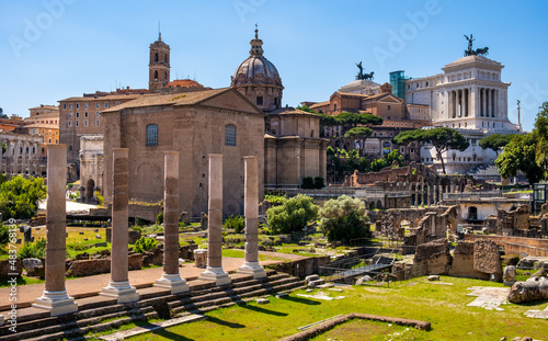Panorama of Roman Forum Romanum with Curia Julia senate house, Santi Luca e Martina church and Altare della Patria in historic center of ancient Rome in Italy