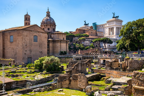 Panorama of Roman Forum Romanum with Curia Julia senate house, Santi Luca e Martina church and Altare della Patria in historic center of ancient Rome in Italy