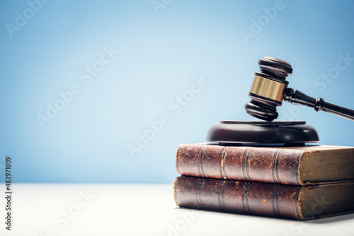 Judge gavel and law books in court background with copy space