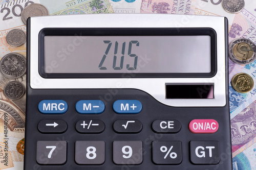 Word ZUS written on a digital display on a calculator, ZUS is a social security system in Poland
