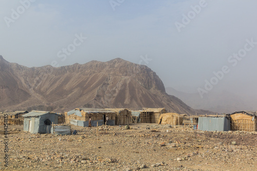 Simple huts of an Afar tribe settlement in the Danakil depression, Ethiopia.