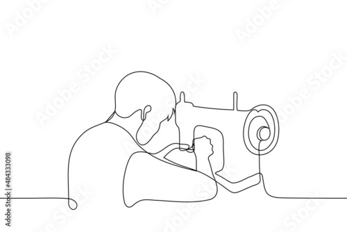 man sitting at vintage sewing machine - one line drawing vector. concept of artisan creates handicrafts, lover of sewing and repairing things, craftsman makes craft items