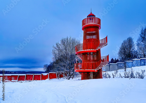 red lighthouse in the snow
