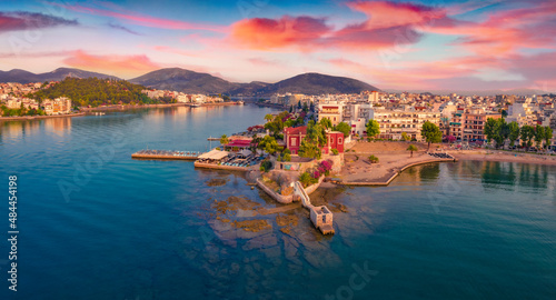 Astonishing summer cityscape of Chalcis town. Dramatic sunrise on Aegean sea, North Euboean Gulf. Captivating morning scene of Euboea island, Greece, Europe. Traveling concept background.