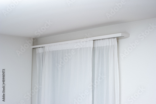 Home drape curtains with wooden masked up hanging rails