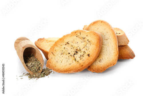 Fresh croutons isolated and scoop with spices on white background
