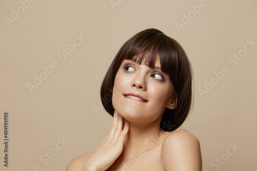 woman hand near face body care model makeup beige background