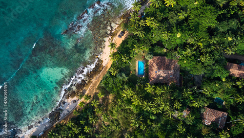 Aerial view of a villa with a swimming pool in the tropics. Hiriketiya beach, Sri Lanka