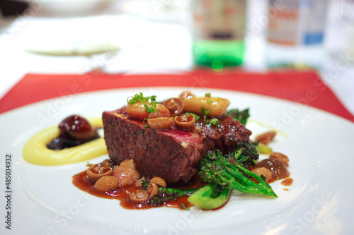 red wine braised steak grilled beef with small mushroom and broccoli