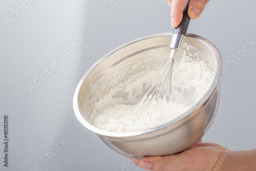 white whipped cream in metal bowl