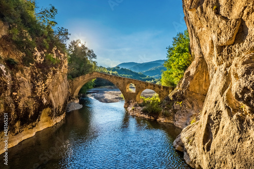 The old stone arched bridge and the canyon of Portitsa, close to Spilaio village, Grevena, West Macedonia, Greece.