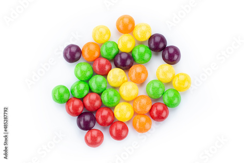 The multicolor flavored fruit candies on white background.