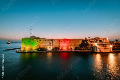 Aragonese Castle of Taranto illuminated at sunset in summer