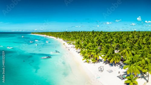 Aerial view of Saona Island in Dominican Republuc. Caribbean Sea with clear blue water and green palms. Tropical beach. The best beach in the world.