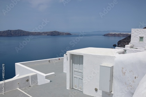 View of traditional whitewashed buildings in front of the beautiful aegean sea in Fira Santorini Greece