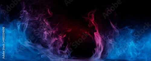 Panoramic view of the abstract fog. Red cloudiness, mist or smog moves on black background. Beautiful swirling blue smoke. Mockup for your logo. Wide angle horizontal wallpaper or web banner.