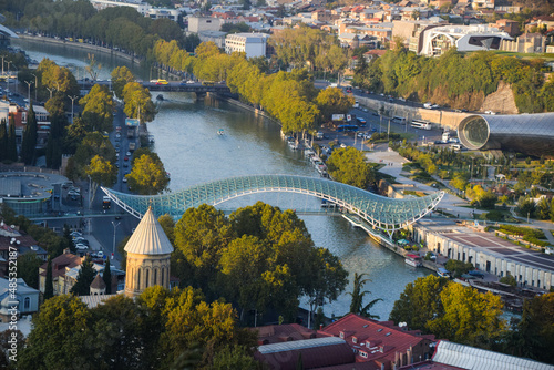 The Tbilisi Peace Bridge from above at day with blue sky in Tiblisi, Georgia