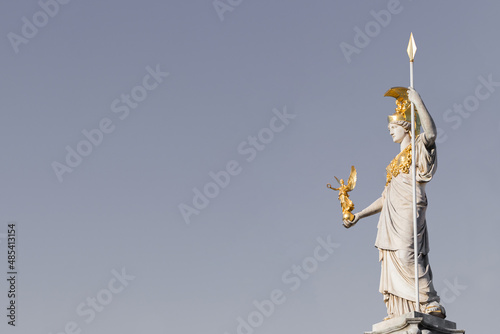 The statue of Pallas Athena on gray background with copy space for your design near Parliament building in Vienna, Austria