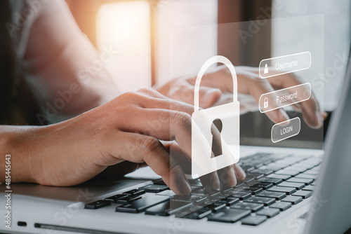 Woman hand typing on keyboard with login and password on screen display, cyber security concept, data protection and secured internet access.