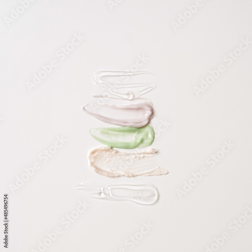 Cosmetic cream smudge setting on white background. Beauty neutral colors cosmetic products collection