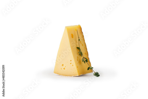 Asiago cheese isolated. Piece of tasty Italian cheese on white with rosemary