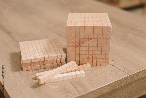 Montessori school. wooden cubes for learning mathematics. alternative education