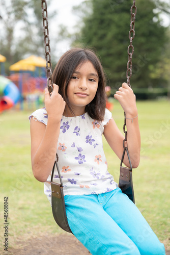 girls playing in the park, during the afternoon on vacation