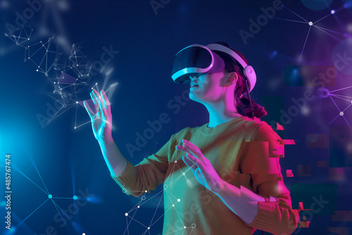 Woman with VR virtual reality goggles