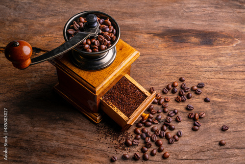 Vintage coffee grinder.Old retro hand-operated wooden and metal coffee grinder.Manual coffee grinder for grinding coffee beans. soft focus.