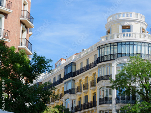 Elegant vintage facades at summertime downtown in Fuencarral district, Madrid, Spain