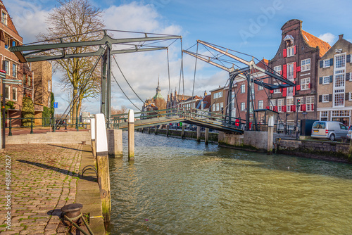 The Damiate Bridge in the historic center of the Dutch city of Dordrecht was built in 1857. The bridge over the water of an inland harbor connects two quays: the Wolwevershaven and the Kuipershaven.