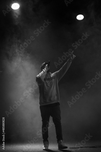 singer and rapper on stage in smoke