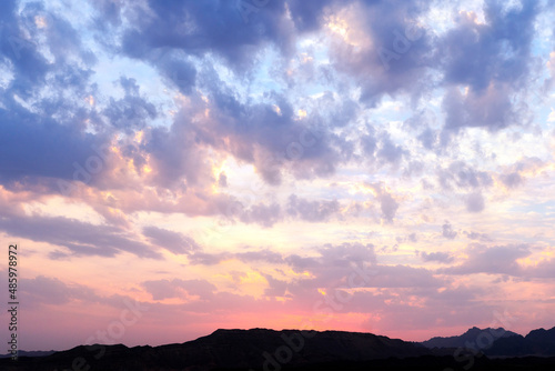 Colorful cloudy sky at sunset. Gradient color purple sky with clouds