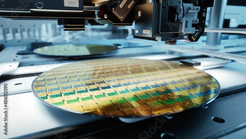 Close-up Shot of Silicon Wafer in Bright light at Advanced Semiconductor Foundry, that produces Computer Chips.