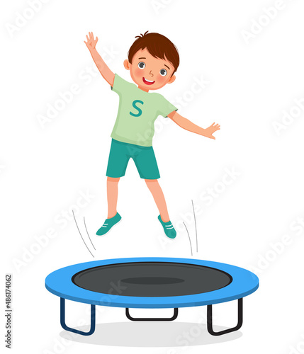 happy little boy jumping on a trampoline having fun playing outdoor sport activity