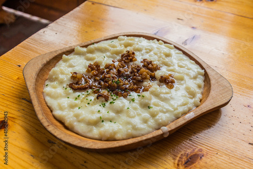 National meal of Slovakia - bryndzove halusky. Boiled lumps of potato dough with a soft sheep cheese
