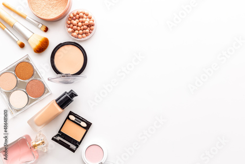 Decorative makeup cosmetic on color background, top view